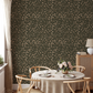 Dining room wallpaper featuring dark and moody overlapping vines and florals 