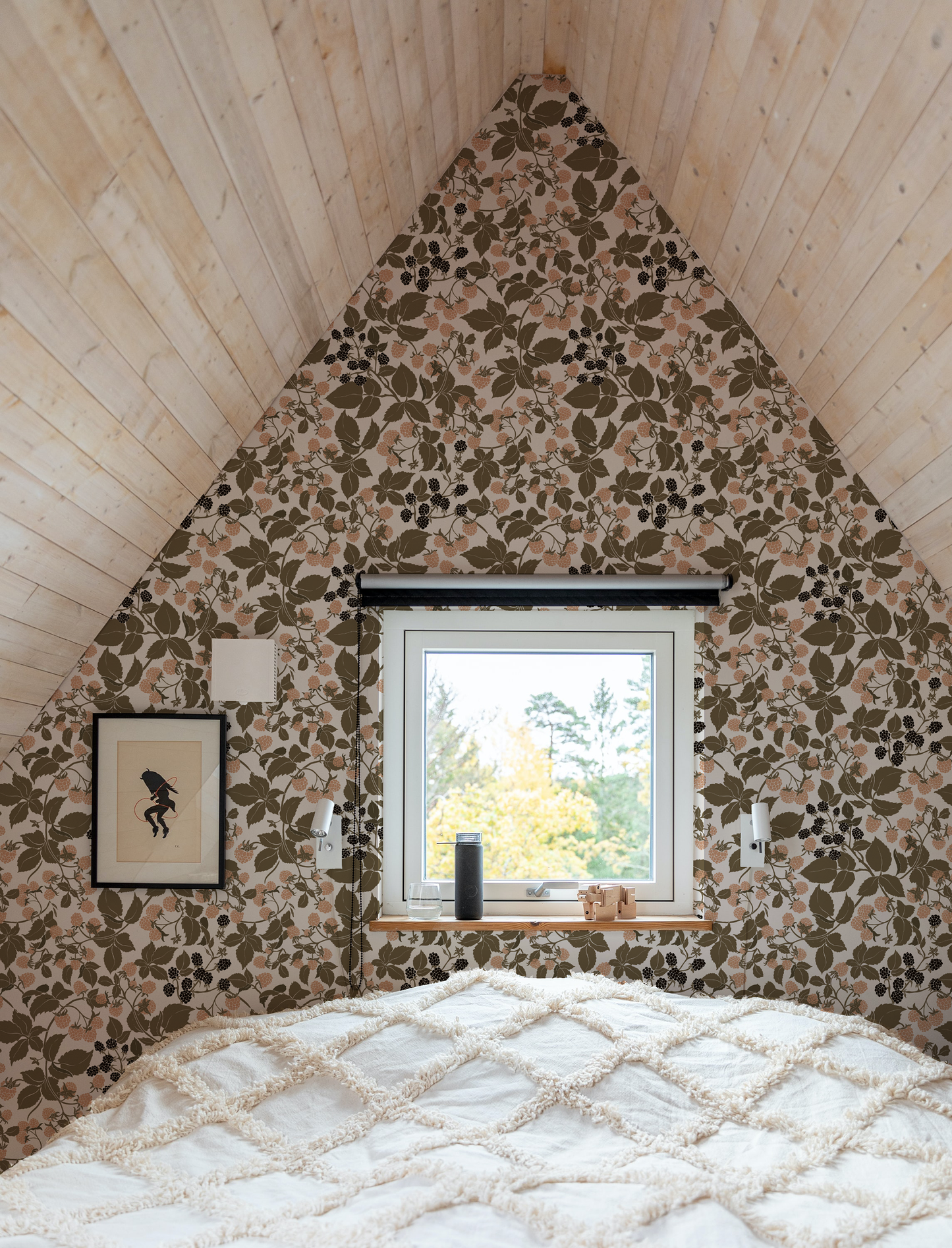 Small a-frame bedroom with floral blackberry and raspberry wallpaper, a window, and a bed.