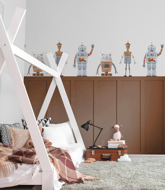 Cute Robot decals in muted blue and brown tones placed on the wall of a boys bedroom with three different variations